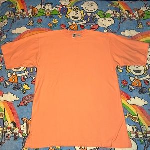 A salmon pink oversized tee